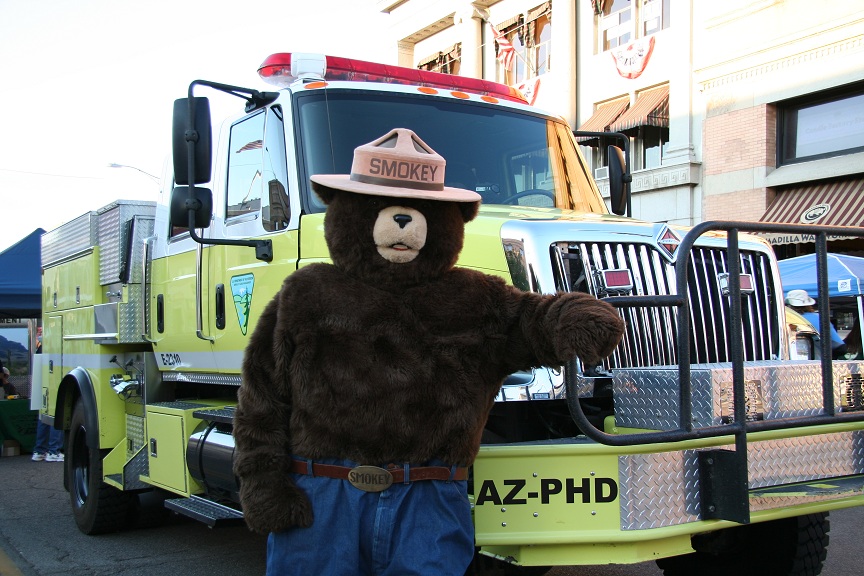 Smokey Bear next to a BLM Fire Engine