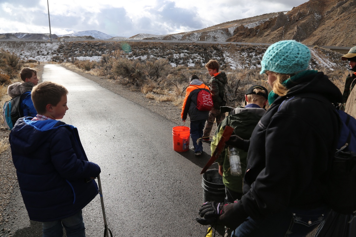 Cub Scout Den leader (on the right) walks with her scouts along the Humboldt River in the Carlin Canyon completing a three-mile hike and service project. The group collected five bags of trash.