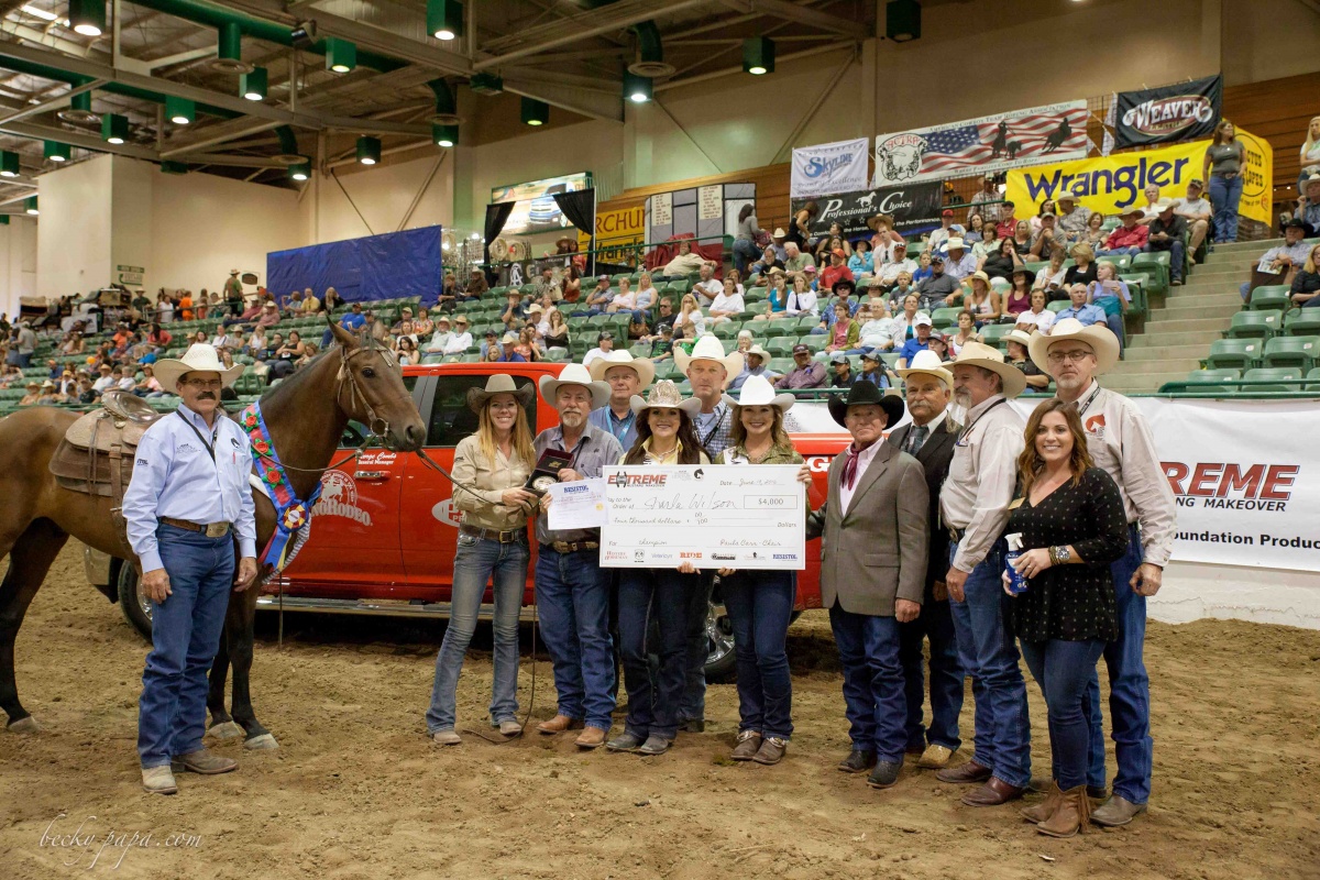 MHF and contestants posing for photo with big check.