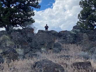 Geocacher finds the hiding spot