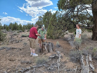 GoldenStateBoy and Porkwatch with BLM Park Ranger Leah Gamble at Stumpied geocache