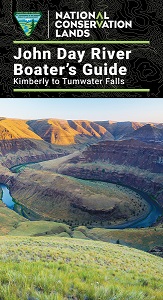 cover of john day wild and scenic river boater's guide with landscape showing a bend in the river and sunlit hills