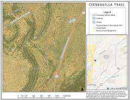 A Color illustration of a map showing La Cieneguilla Trail. The map contains icons representing La Cieneguilla Trail, the trailhead, El Camino Real De Tierra Adentro National Historic Trail and County Road 56. Color outlined areas represent Bureau of Land Management lands.