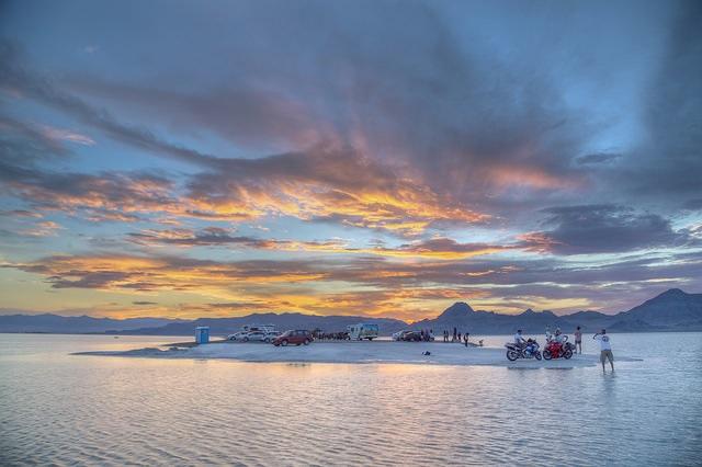 Visitors to the Bonneville Salt Flats in UT look over the Great Salt Lake. Photo by Bob Wick.