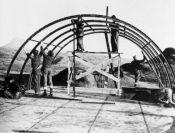 WWII crew assembling quonset hut