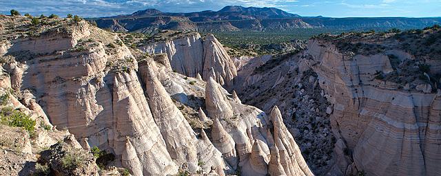 The cone-shaped tent rock formations against a blue sky at Kasha-Katuwe Tent Rocks National Monument.