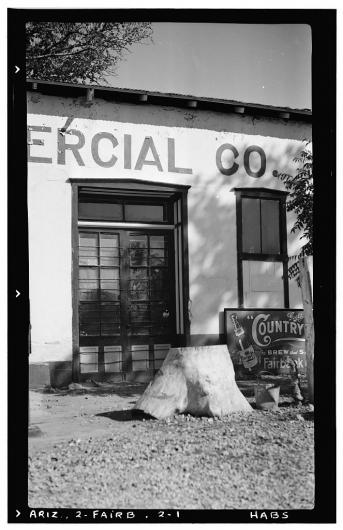 a historic photo of the entrance to the Fairbank Mercantile shows a door and sign 