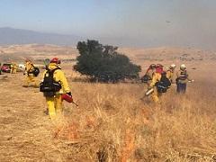 Fire Fighters conduct a prescribed burn at Lake Mathews. Photo by the BLM.