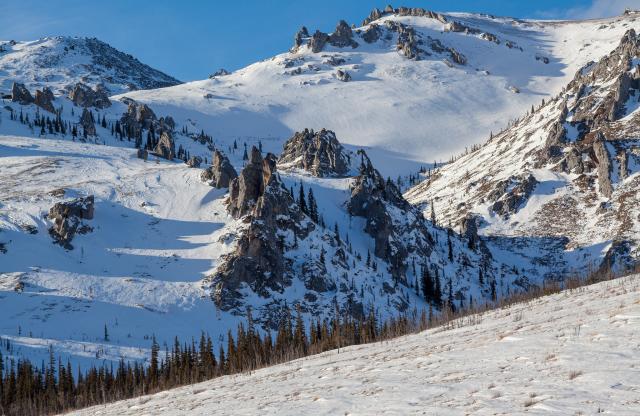 Jags jutting from snow-covered mountain