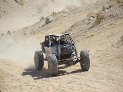 Off-Road Vehicle at King of the Hammers drives down a dusty path. Photo by Dave Christy, BLM.