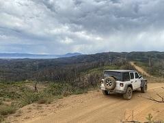 Jeep on a high trail overlooking Clear Lake. Photo by Tim Pananos, BLM.