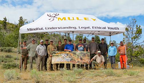Mule Deer Foundation volunteers standing under an awning. 