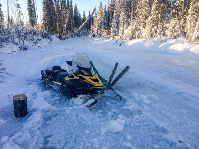 Snow machine stuck in ice