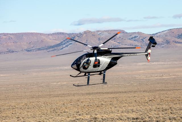 Helicopter flying over a desert