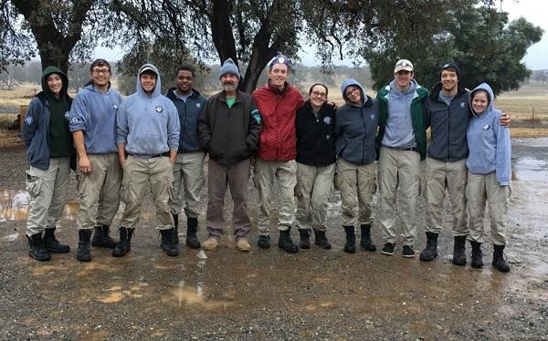 Jeff Batterson (middle, brown coat) welcomes an AmeriCorps work crew to the Sacramento Bend ONA