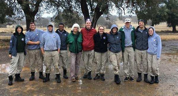 Jan McCullough (middle, green coat) welcomes an AmeriCorps work crew to the Sacramento Bend ONA.
