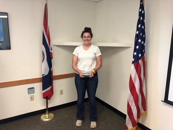 Outstanding Youth winner Cassie Hengel receives her award in a ceremony at the Buffalo Field Office.
