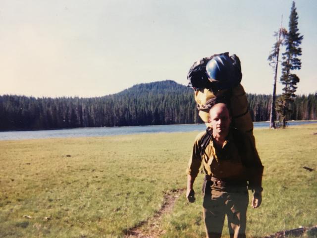 Man with large pack on his back.