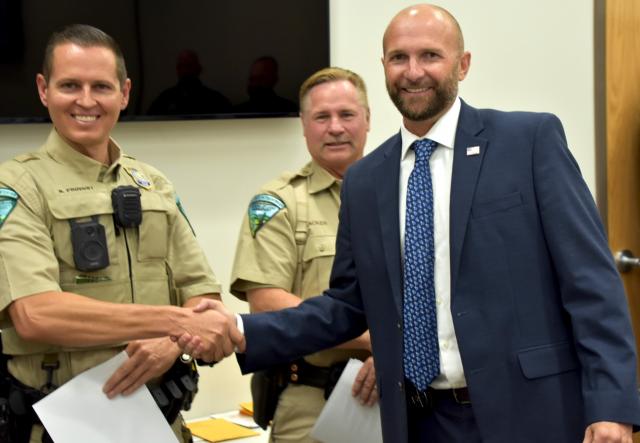 Deputy U.S. Marshal Pete Thompson recognizes Grand Canyon-Parashant National Monument Ranger Brice Provost.