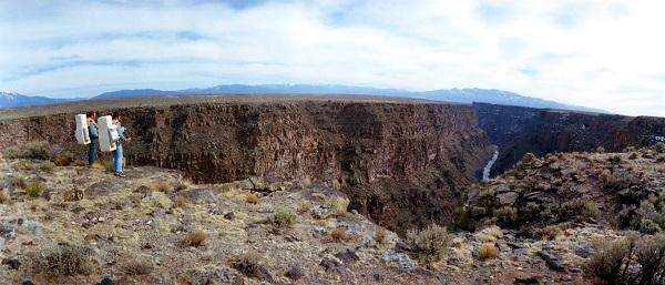 Jim Irwin (right) and Dave Scott examine the interior of the Río Grande Gorge from the west rim during their training March 11–12, 1971. 