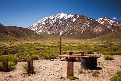 Camp site with large mountains in the Background. Photo by Jesse Pluim, BLM. 