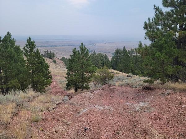 A portion of the all-terrain vehicle trail located on BLM-managed land was badly rutted due to poor drainage. The crew smoothed out the ruts, cut water bars, and added a curve to the trail to mitigate future issues.