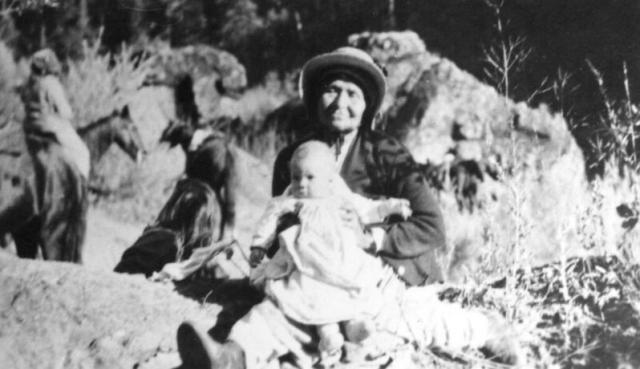 An undated image of a woman holding a baby (early 20th century?)