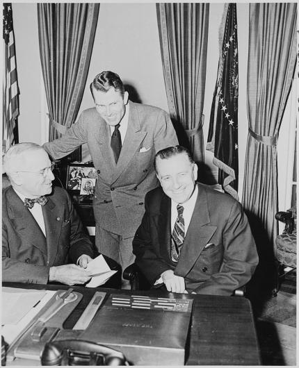 President Harry Truman with Department of Interior officials in the Oval Office