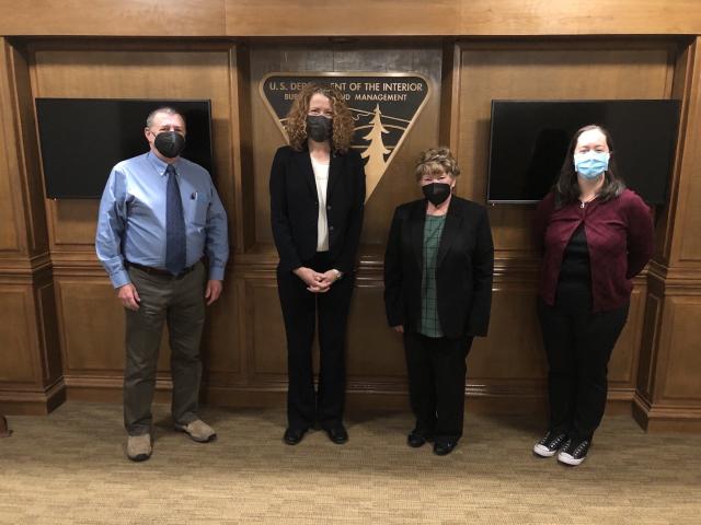 BLM Director Stone-Manning stands with outgoing President of the Public Lands Foundation Ed Shepard, Public Lands Foundation President Mary Jo Rugwell and Executive Director Courtney Lyons-Garcia