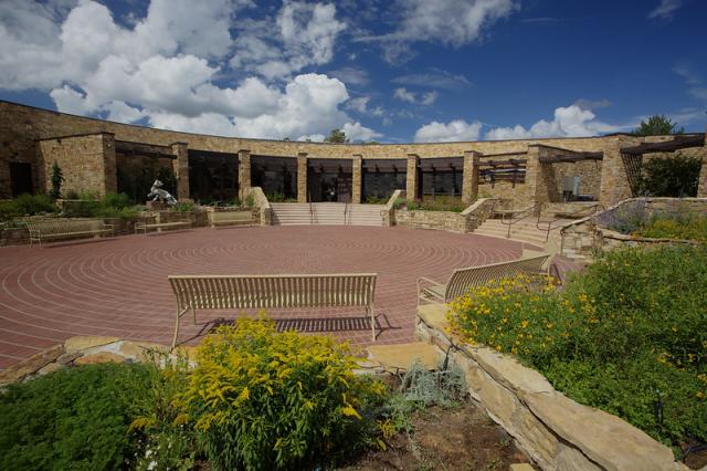 a building and courtyard, the Anasazi heritage center in Colorado