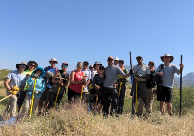 Public land visitors gather together for volunteer clean-up project