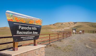 Sign for Panoche hills leading into grassy hills
