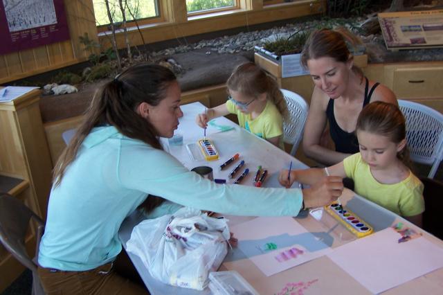 Woman sharing art with kids