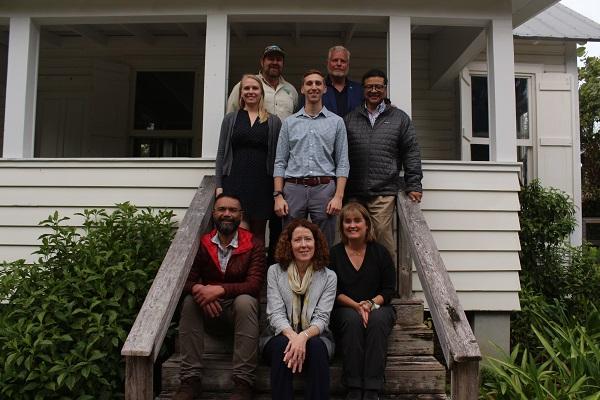 BLM Eastern States staff and the BLM Director sitting on the steps steps of the Tindall House