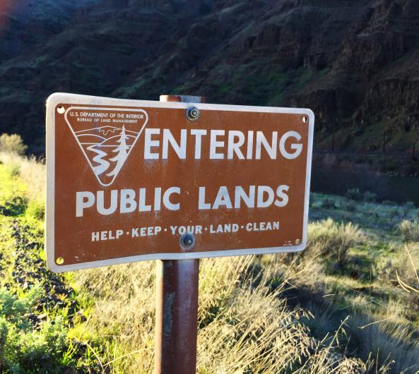 brown sign with white lettering. "Entering Public Lands"