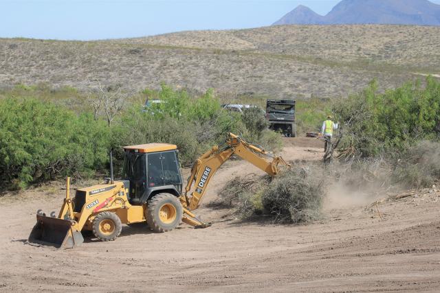 BLM teams using heavy equipment to clear brush. 