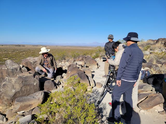 Las Cruces District archaeologist Cody Dalpra he is leading an interpretive hike at the Three Rivers Petroglyph Site for MBC out of South Korea.