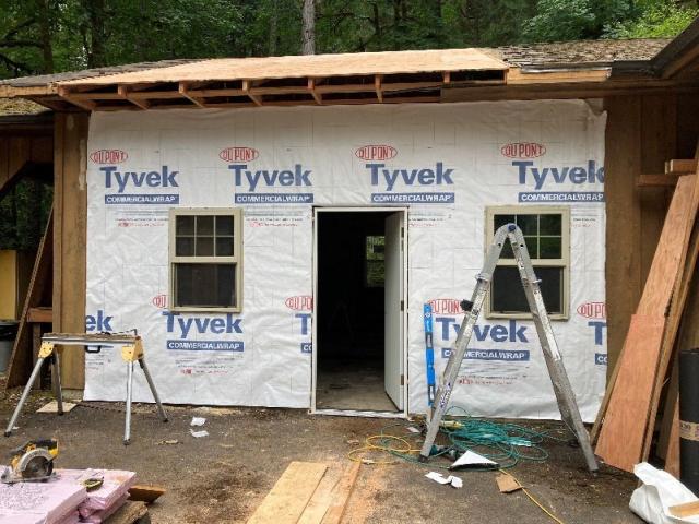 shop building at Loon Lake Recreation Site that was partially destroyed by a tree