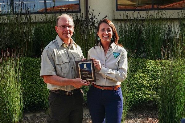 BLM California Public Affairs Specialist Erica St Michel and Fort Ord National Monument Manager Eric Morgan holding the Ed Hastey Award plaque.