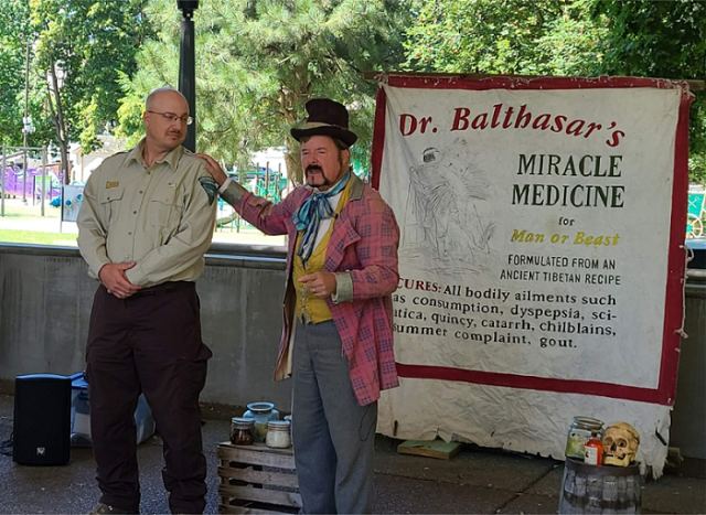 person in old time costume portraying Doctor Balthasar