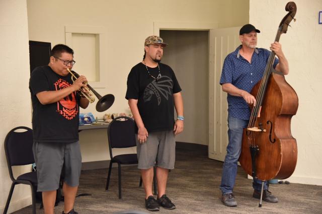 Artist in Residence Delbert Anderson and his group D'DAT share an original piece with students at the musical workshop in Blanding, Utah at the Edge of the Cedars Museum.