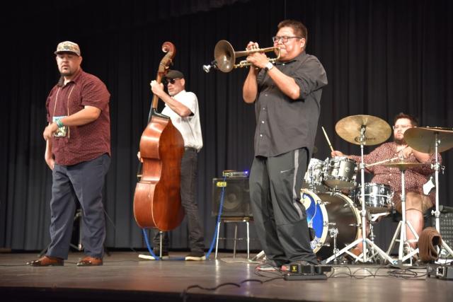 D'DAT band grooving on stage as they preform Artist in Residence concert for Bears Ears National Monument.