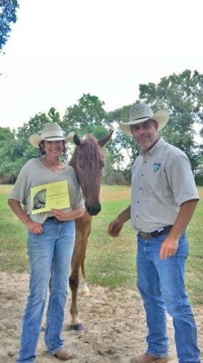 Woman and man with horse