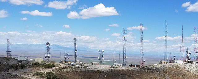 Communication towers on a hilltop right of way on public land