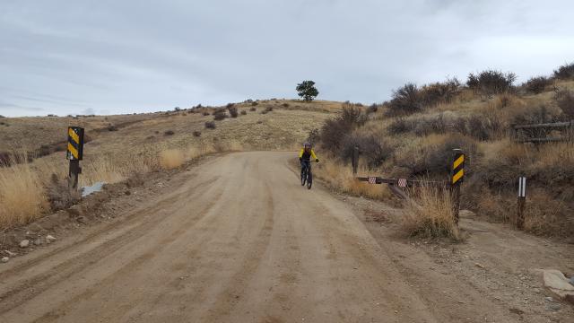 A bicyclist rides towards the upper 8th Street gate on BLM lands in the Boise Foothills. Photo by BLM.