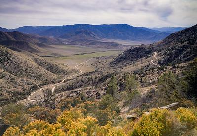 Hills with fall foliage in the foreground. 