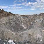 Gravel pit with blue sky and clouds. 