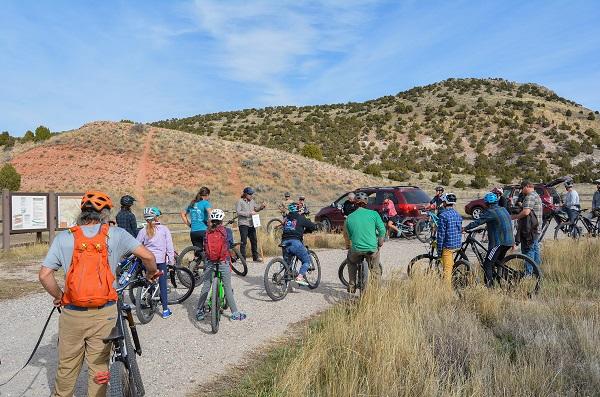 Riders gather at Johnny Behind the Rocks as Wyoming Pathways Executive Director Michael Kusiek discusses the day’s plan.