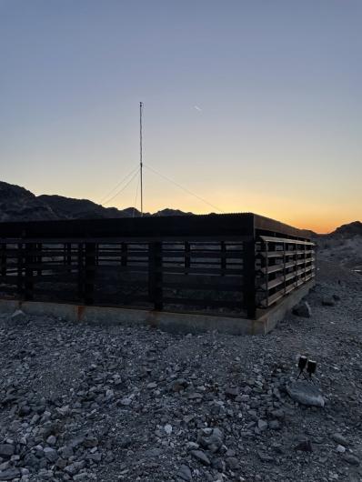 Bat acoustic equipment monitoring on top of the Queen Mine Cupola at sunset.