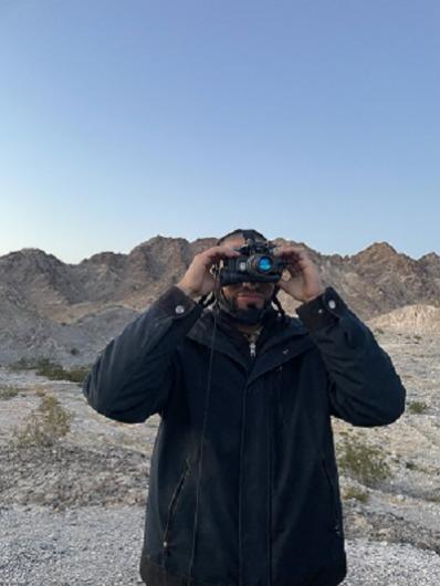 Damian Montano, BLM El Centro Park Ranger, sets up his night vision goggles before the bat survey.